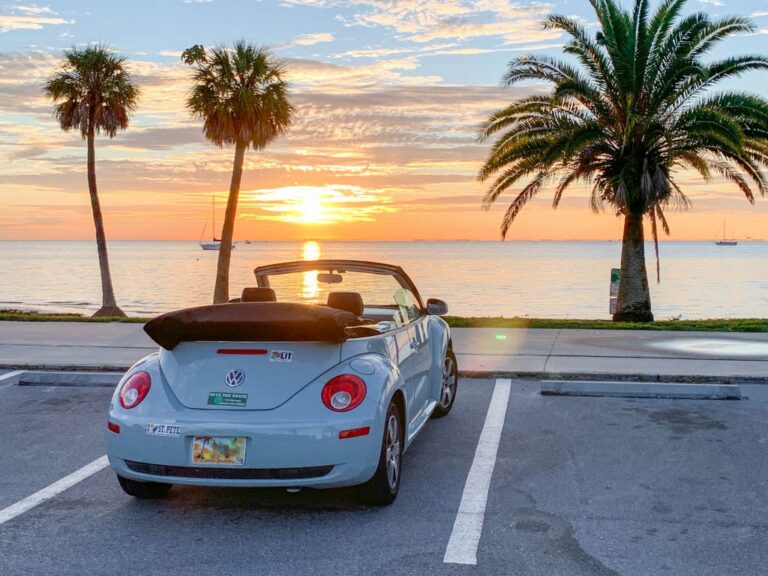 Convertible in front of beach in Florida during beautiful sunset