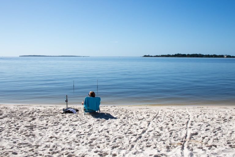 Sunbathing on a beach in Cedar Key, Florida