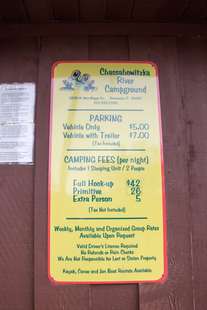 A sign displays prices for the Chassahowitzka River Campground and Boat Ramp 