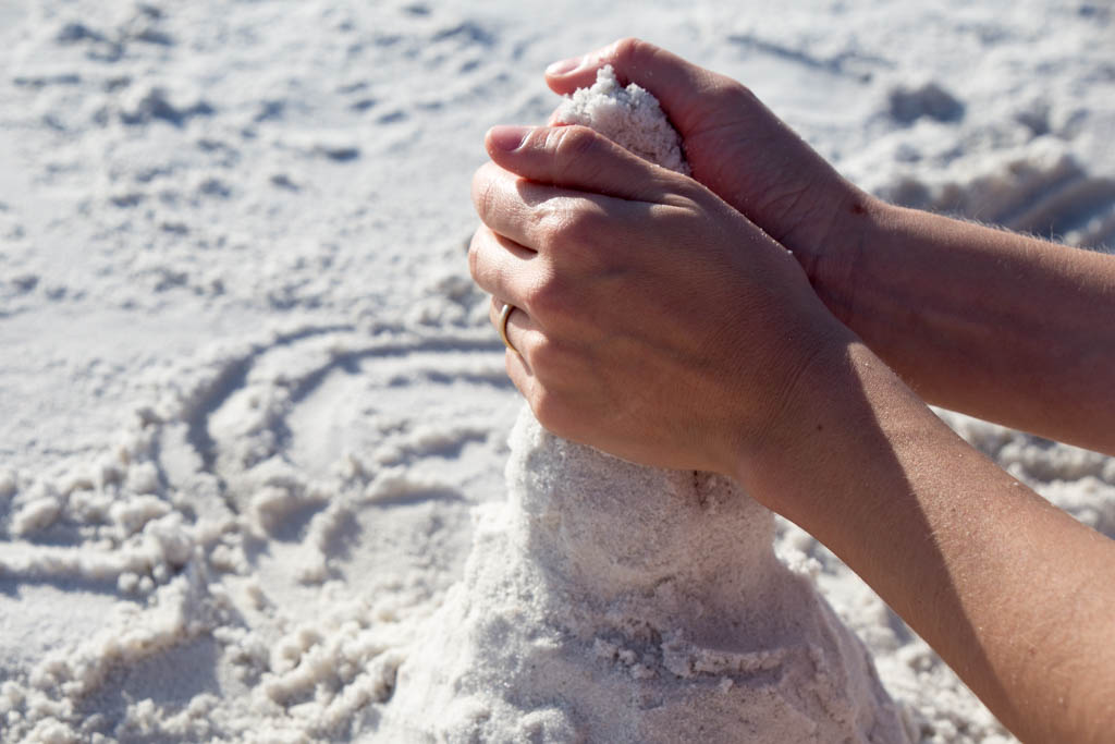 Building a snowman out of sand in Florida