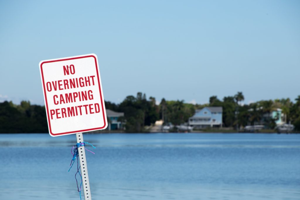 A sign says "No Overnight Camping" in Key West, Florida