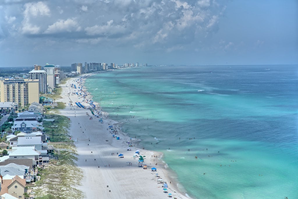 Aerial view of clear water and white sand in Panama City Beach in the Florida panhandle