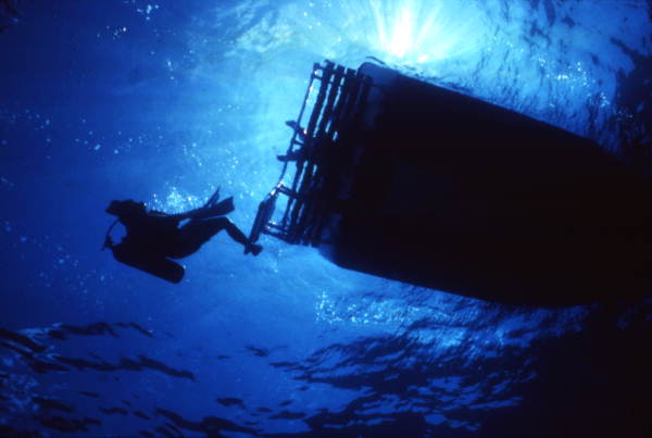 Scuba diver dives from dive boat in Key West, Florida