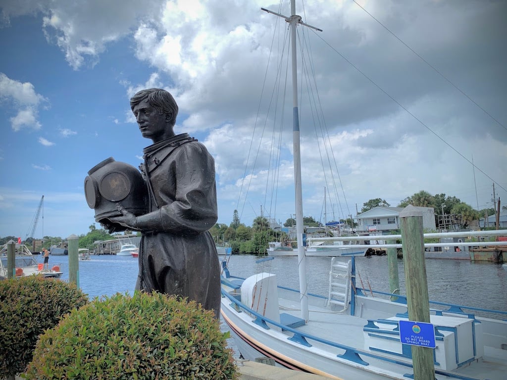 A statue of a sponge fisherman in the historic sponge docks, Tarpon Springs, Florida