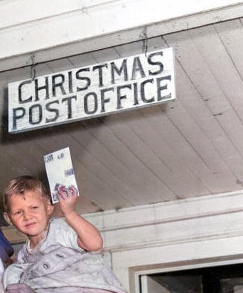 A boy visits the post office in the town of Christmas, Florida