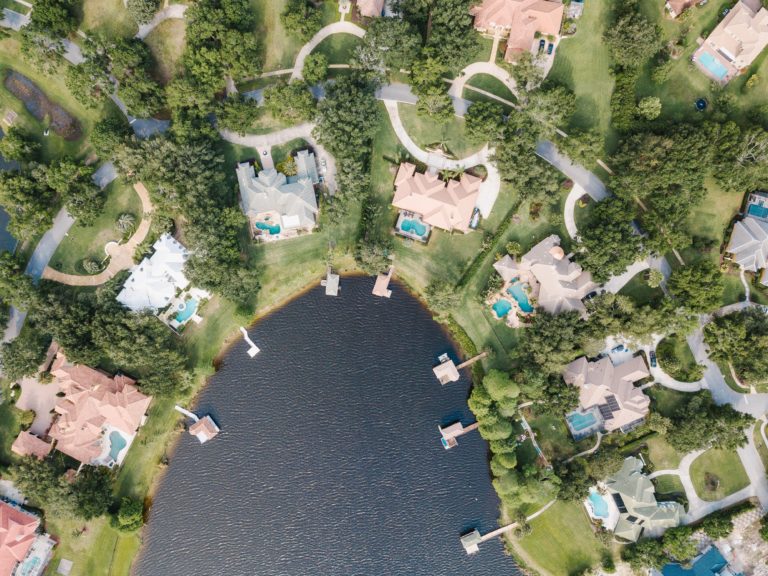 An aerial drone photo of luxury waterfront homes in Windermere, Florida, one of the best suburbs of Orlando